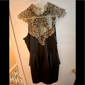 Excellent used condition, black peplum mini dress.